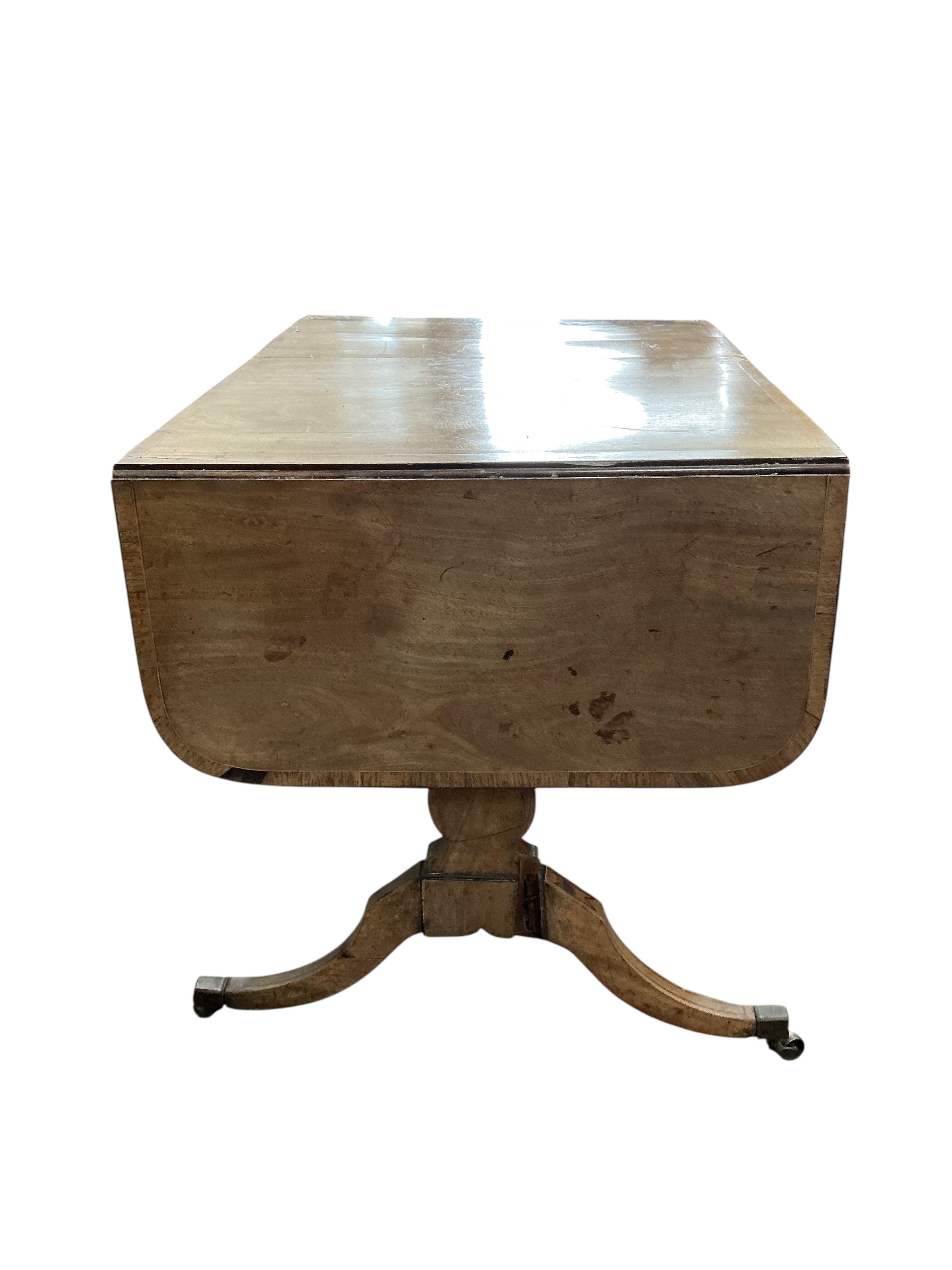 A Regency banded mahogany sofa table, damaged, width 89cm, depth 65cm, height 71cm